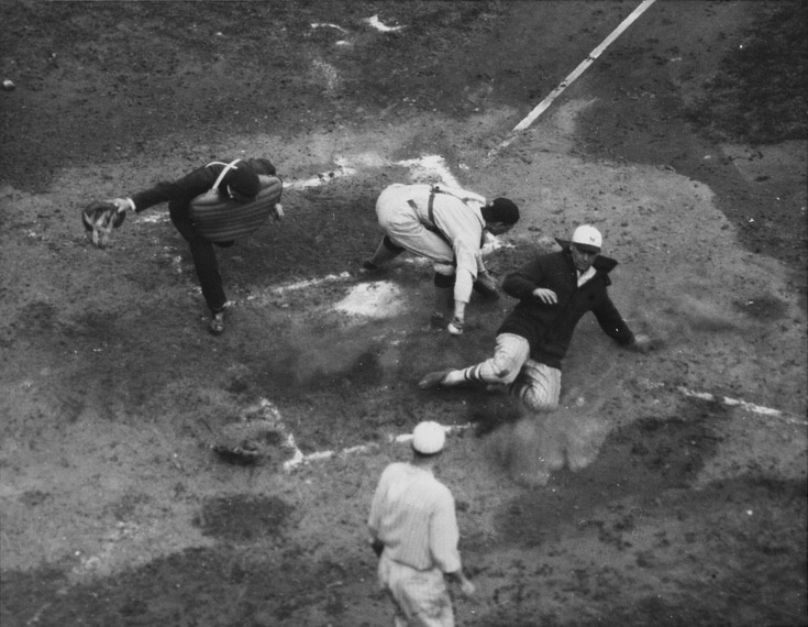 Likely Giants pitcher Art Nehf sliding in safely at home during game one of the 1924 World Series 